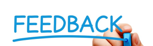 A person holding their hand over the word feedback.